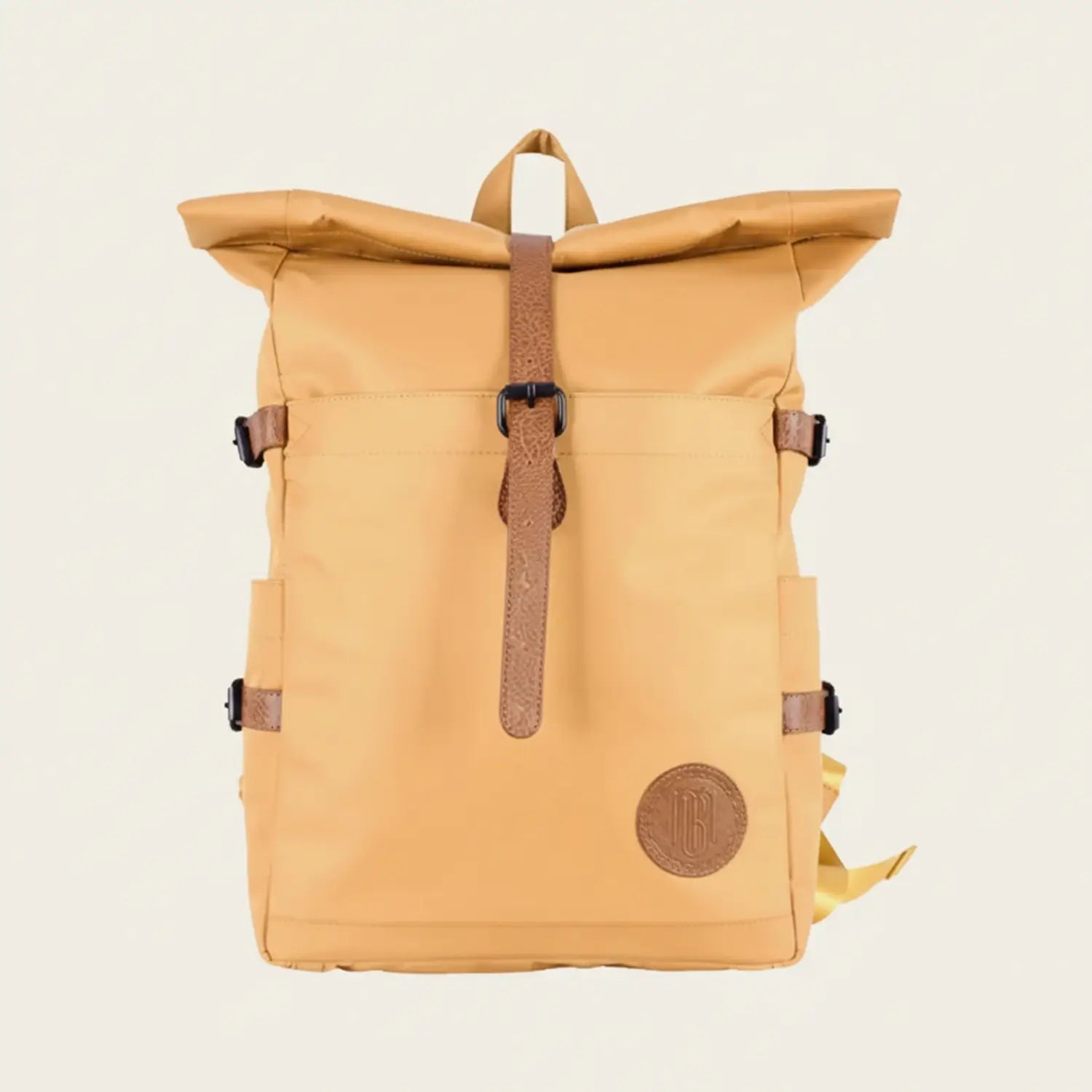 Yellow backpack with brown straps on a light beige background