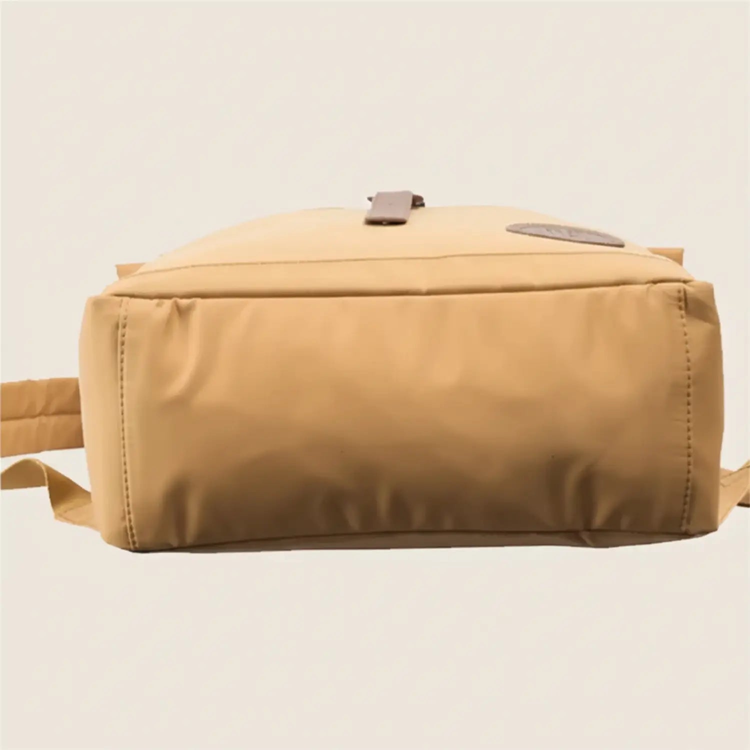 mustard backpack on a white background
