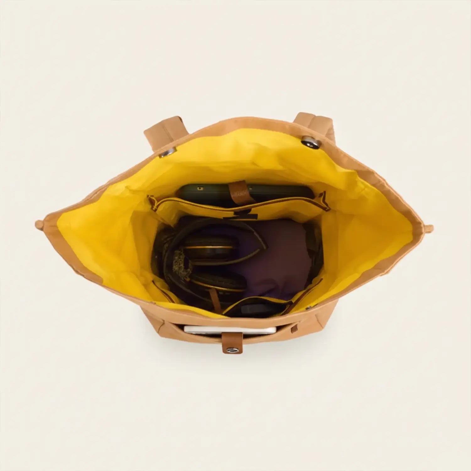 mustard backpack with yellow interior on a white background