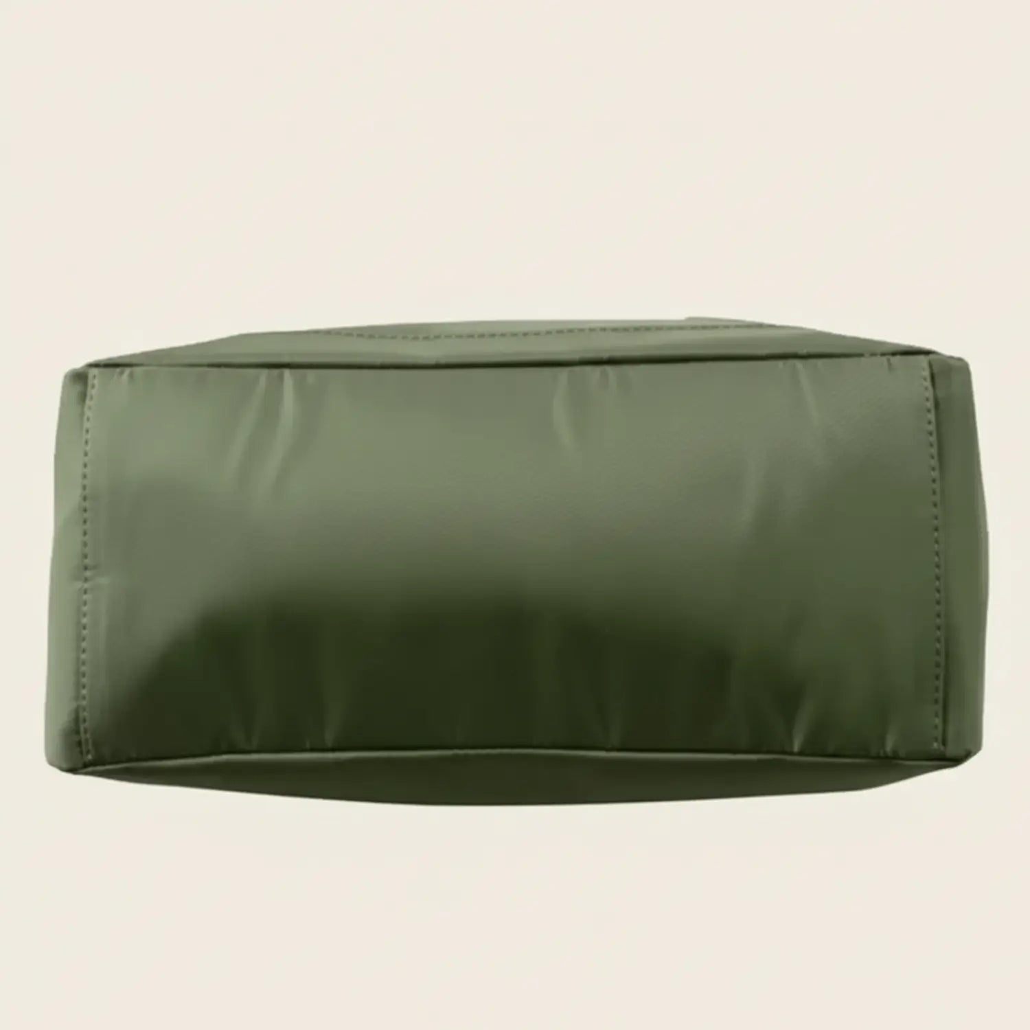 Green backpack on a white background